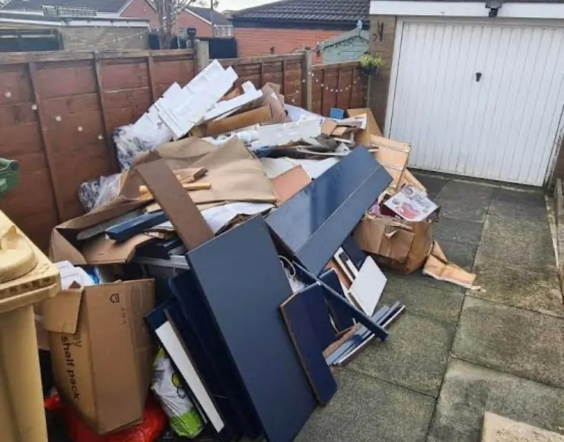 A big pile of household rubbish ready to be loaded and taken away
